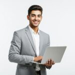a man in a grey suit is holding a laptop premium ai generated image